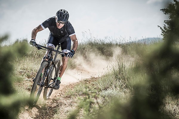 Mountain Biker on a dusty trail